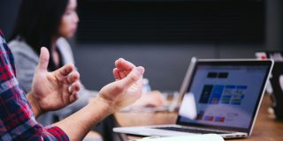 Here's why Apple is right to hold firm on its DEI policies | Stock photo of a meeting
