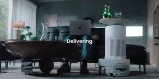 The SwitchBot K20+ Pro is the silliest robot vacuum cleaner, seen here delivering drinks