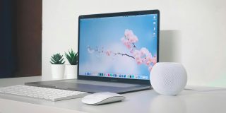 Mac market share growing faster than top three PC brands | MacBook Pro pictured on a desk with Apple accessories