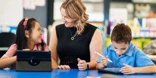 Apple legally responsible for age verification of App Store users in Utah | Woman and two kids using Apple devices