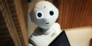 There are two big issues with Apple's reported 'AI doctor' plan | Friendly-looking white robot