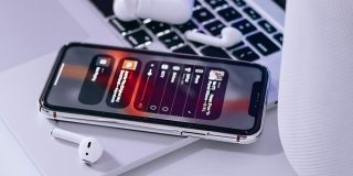 Apple Music tool to import playlists from Spotify and more looks to be rolling out | Apple Music seen on iPhone alongside AirPods