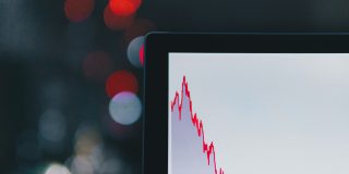 iPhone and other smartphone imports from China hit lowest level since 2011 | Red graph on MacBook showing sharp fall