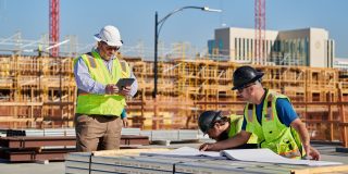 Amazon and Apple best deliver on affordable housing promises, as other tech giants falter | Construction workers study plans