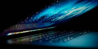 Apple security bounties slashed as Mac malware grows | Lowkey shot of partially-open MacBook