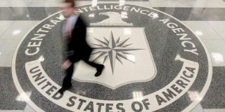 Tim Cook 'slept with one eye open' after classified CIA briefing on Taiwan | Photo shows a man walking across the CIA logo on the floor of an agency building