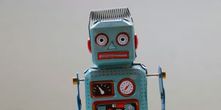 WhatsApp joins the appalling trend for AI-written replies to messages | Crude-looking toy robot shown.