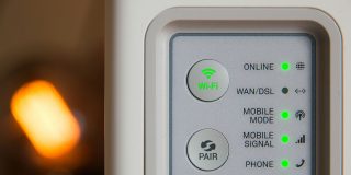 Your wireless router is now banned from sale in the US, but you can still use it | Close-up photo of the back of a consumer router
