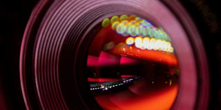 200MP iPhone camera rumors align on 2028 release | Stock photo shows a close-up of a camera lens