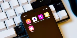 3 million dating app photos used for AI training before FTC privacy enforcement | OkCupid and other dating apps seen on a smartphone screen against a mechanical keyboard background