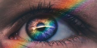 You can create a multicolor MacBook Neo with official Apple parts for just $39 | The photo shows a rainbow reflected in a close-up of someone's eye