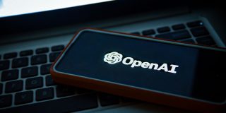 A security breach means you must update the ChatGPT Mac app | Photo shows the OpenAI logo on a phone sitting on a laptop