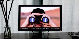 AI companies and data brokers sell our personal data even when told not to | Image shows a pair of binoculars with Facebook logos in the lenses