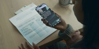 Apple announces AI-powered accessibility features and eye-controlled wheelchair functionality | Photo shows VoiceOver being used to summarize a water bill