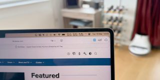 How to stop menu bar items being hidden behind the MacBook Pro notch | Photo shows menubar items with the spacing reduced by half