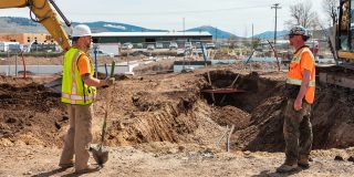 You can preview the new, new Digg after its takeover by bots | Photo shows two construction workers looking at the hole they've just dug