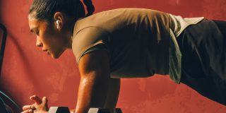 AirPods Pro 3 worn by a woman doing a workout