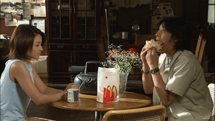 Kamen Rider Kuuga's Yusuke noshing on some McDonalds.