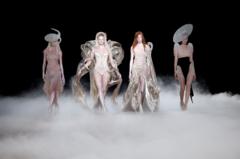 Models present creations by designer Iris van Herpen as part of her Haute Couture Fall/Winter 2026-2027 collection show in Paris, France, July 6, 2026. 