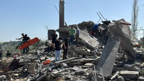 Reuters Emergency responders inspect the site of an Israeli strike in Saksakiyeh, Lebanon, on 9 May 2026.