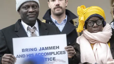 EPA Victims and their relatives demonstrate in front of the Federal Criminal Court of Switzerland before the beginning of the trial against Gambia's former Interior Minister Ousman Sonko in Bellinzona, Switzerland, 08 January 2024.