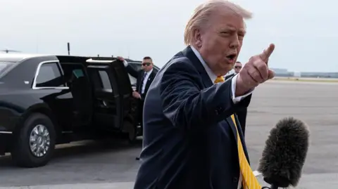 Getty Images US President Donald Trump speaks to reporters in Palm Beach, Florida. Photo: 2 May 2026