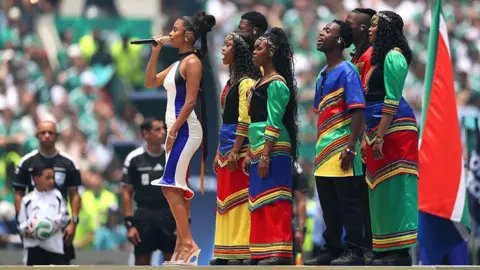Getty Images Tyla sings the South African national anthem during the FIFA World Cup 2026