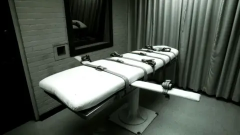 Getty Images A bed with straps on it in an execution chamber