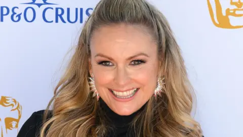 Getty Images Mel Schilling smiling at the Baftas in May 2025