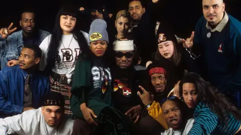 Getty Images Afrika Bambaataa poses with members of the Zulu Nation crew 