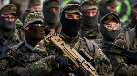 EPA German army soldiers march at Hamburg Port terminal during the German Armed Forces and civilian authorities' military exercise 'Red Storm Bravo' in Hamburg, Germany, 25 September 2025