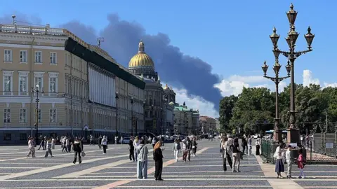 Reuters Smoke billowing over central St Petersburg