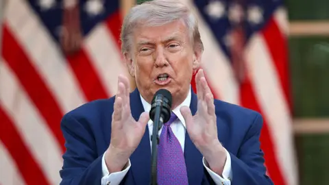 Getty Images US President Donald Trump wearing a purple tie.