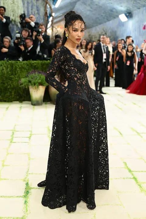 Getty Images Zoe Kravitz wears a black lace dress.