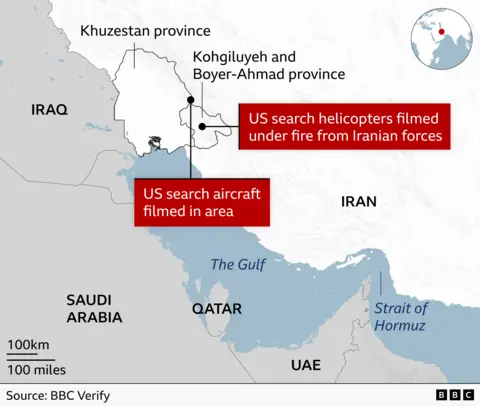 The image is a news-style map focused on southwestern Iran and nearby regions. It highlights Khuzestan province and Kohgiluyeh and Boyer-Ahmad province in Iran, near the border with Iraq. Red labels indicate reported incidents: “US search helicopters filmed under fire from Iranian forces” in Kohgiluyeh and Boyer-Ahmad province. “US search aircraft filmed in area” near Khuzestan. The map also shows nearby countries including Saudi Arabia, Qatar, and the United Arab Emirates. Key geographic features include The Persian Gulf and the Strait of Hormuz. Overall, it’s illustrating the location of reported US search operations and alleged Iranian engagement in southwestern Iran, based on BBC Verify reporting.