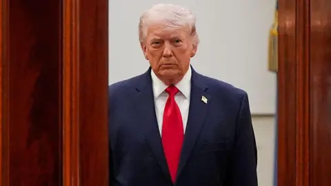 Bloomberg via Getty Image US President Donald Trump arrives for a prime-time address to the nation in the Cross Hall of the White House in Washington, DC, US, on Wednesday, 1 April, 2026.