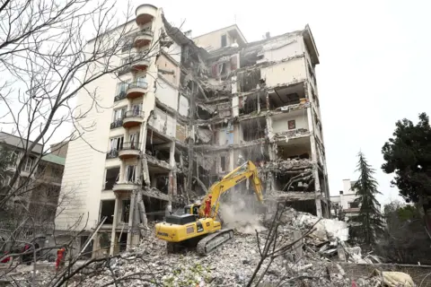 WANA via Reuters A view of a residential building damaged by a strike, amid the US-Israeli conflict with Iran, in Tehran, Iran, March 23, 2026