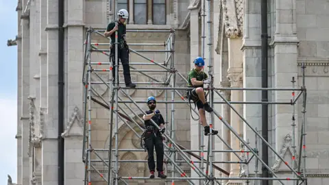AFP via Getty Images Workers build metal scaffolding at the Hungarian Parliament building as preparations are underway on May 7, 2026 in Budapest's Kossuth Square for the inaugural session of the new parliament