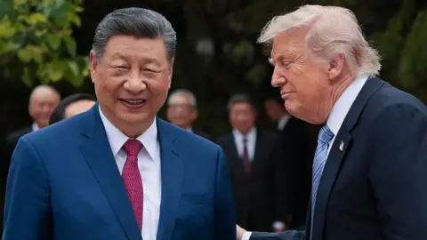 Getty Images US President Donald Trump (R) speaks with China's President Xi Jinping as he leaves after a visit to Zhongnanhai Garden in Beijing on May 15, 2026. 