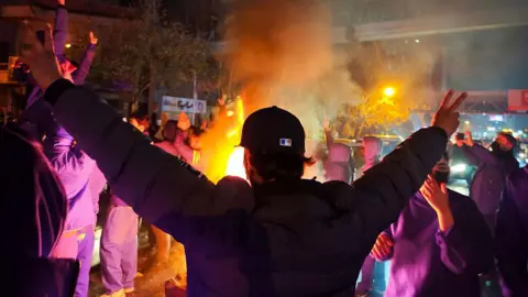 Getty Images Fires are lit as protesters rally on January 8, 2026 in Tehran, Iran. 