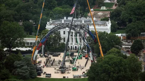 Kevin Dietsch via Getty Images Construction continues for the upcoming UFC match on the South Lawn of the White House in Washington, DC.