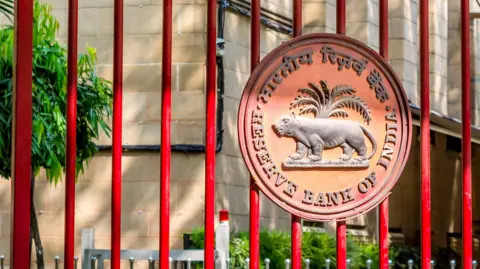 Getty Images Reserve Bank of India logo on the closed red iron gate of the New Delhi branch. 