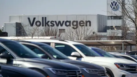 Getty Images Volkswagen cars are seen in the employee parking lot at the Volkswagen automobile assembly plant on 20 March 2024 in Chattanooga, Tennessee.