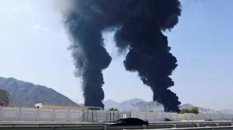 Reuters Smoke rises in the Fujairah oil industry zone, caused by debris after interception of a drone by air defenses