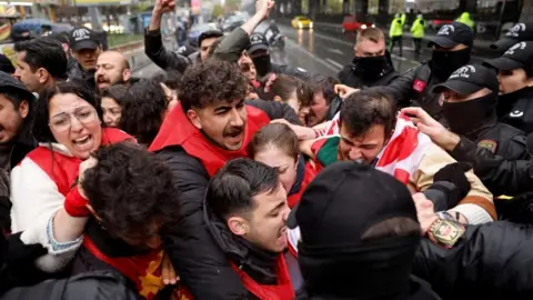 Reuters Members of Workers' Party of Turkey (TIP) scuffle with riot police in Taksim Square, in Istanbul, Turkey, on 1 May 1, 2026