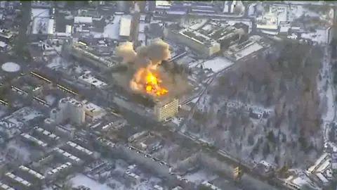 Reuters Fire and smoke rising from a building in the middle of built-up areas