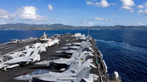 Reuters Lines of warplanes on the deck of the USS Gerald R. Ford aircraft carrier in the sea near the US Virgin Islands