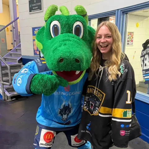 Sophie Bonser Picture of Sophie Bonsor in a Panthers jersey with a mascot by her side