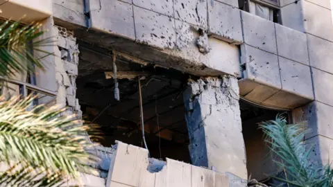 EPA Exterior damage to a room at the Ramada Plaza hotel following an Israeli strike that the Israeli military says killed four Iranian Revolutionary Guards, in Raouche, Beirut, Lebanon (8 March 2026)