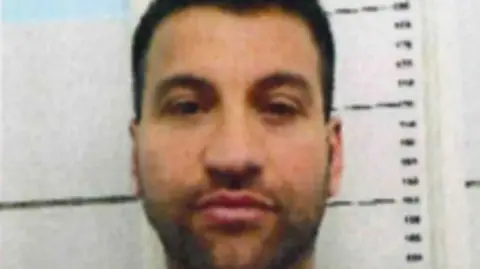 Italian Interior Ministry A close up mug shot of Roberto Mazzarella - just his face is visible and slightly out of focus 